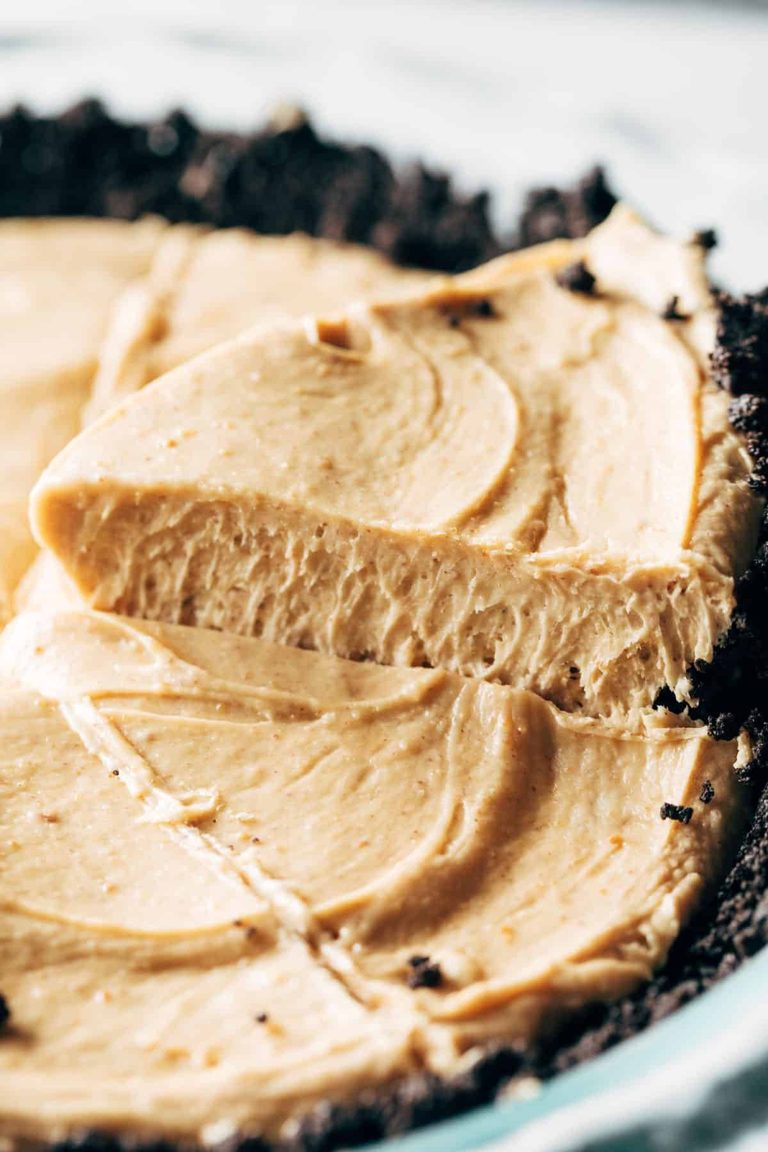 Peanut butter pie with slice lifted out.